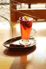 Raspberry tea with cinnamon and orange. Warming tea 
Tea with raspberries, cinnamon and orange. Warming tea