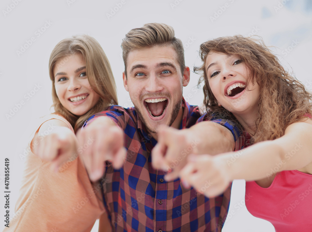 Canvas Prints closeup of three happy young people showing hands forward