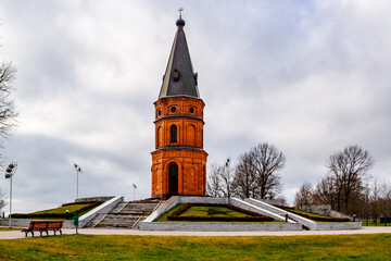 Buynichskoe field WWII memorial. Mogilev, Belarus - 28 November 2021: Brick red church. 
