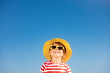 Happy child having fun outdoor against blue sky - 478857278