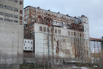 Old and rusty abandoned factory and storage buildings