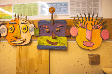 Kids drawings hanged on wall in the school