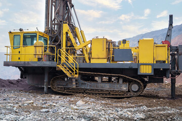 Part of a drilling rig in a mining quarry. Preparation of boreholes for laying explosives, ore mining technology in the quarry.