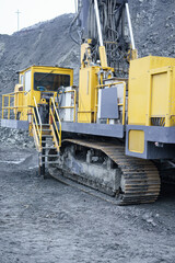 Part of a drilling rig in a mining quarry. Preparation of boreholes for laying explosives, ore mining technology in the quarry.