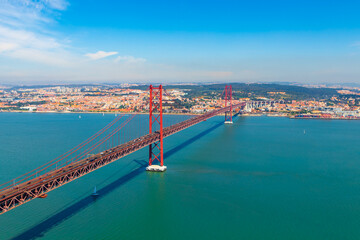 Fototapeta na wymiar A view of the 25 April Bridge (Ponte 25 de Abril) and Lisbon, Portugal in the background.