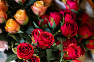 Bright beautiful bouquet of red and orange flowers, fragment, close. High quality photo