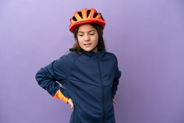 Little caucasian girl isolated on purple background suffering from backache for having made an effort