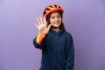 Little caucasian girl isolated on purple background counting five with fingers