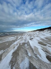 Cold winter day with plenty of snow on the beach