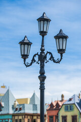 Classic victorian street lamps on an old fashioned iron lamp post set, close up