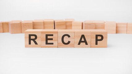 recap word, text, written on wooden cubes, building blocks, over white background