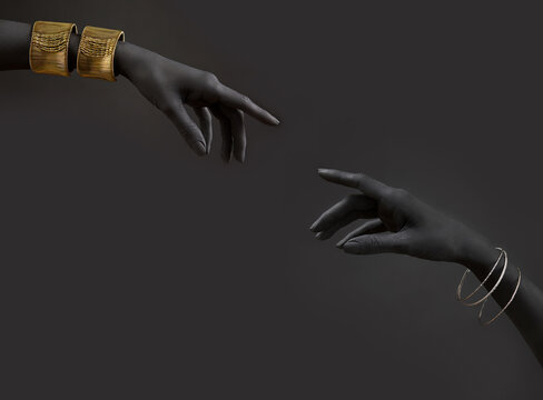 Black woman's hands with gold jewelry. Oriental Bracelets on a black painted hand. Gold Jewelry