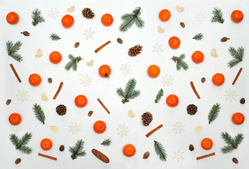 winter composition from fir tree branches  mandarins  pine cones snowflakes cinnamon sticks . christmas-pattern.flat lay. top view 