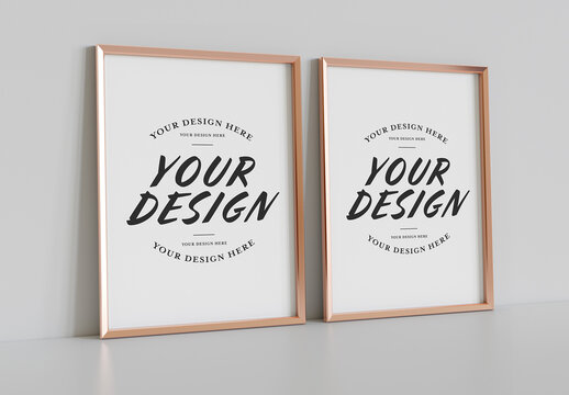 Two Golden Frames Leaning on White Wall Mockup
