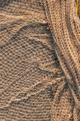 Dark yellow  pattern of fishing net beige background.