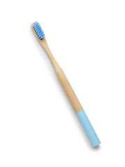 Blue bamboo toothbrush on white background