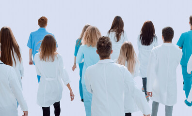 background image of a group of doctors walking together