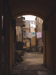 An arch to enter classic Odessa old yard. And bright sunny spring atmospheric photo with vintage...