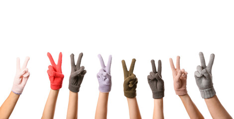 Women in warm gloves showing victory gesture on white background