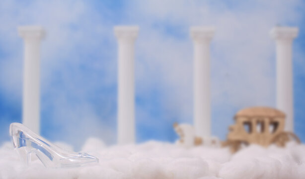 Glass Slipper With Snow or Clouds and Carriage in Background