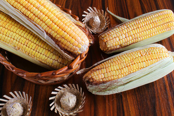 Corn cobs with straw hat miniatuares. June Party Food, Brazilian food.