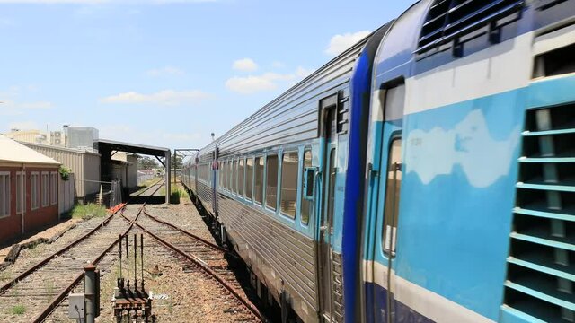 Cabin and tail of Passenger train departing Wagga Wagga train station in 4k.
