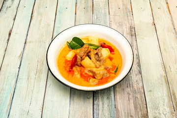 Red Curry is very popular in Thai cuisine with coconut milk heated with red curry paste and fish sauce. Different meat contents are usually poured into the mixture as well as Thai basil