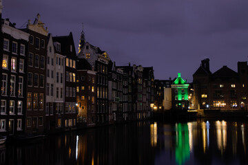 Fototapeta premium Famuos Damrak floating houses. Amsterdam sightseeing tourism attraction.
