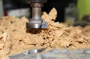 Close-up of a wooden Mill surrounded by chip