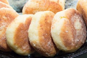 Cottage cheese cheesecakes, baking in a frying pan.