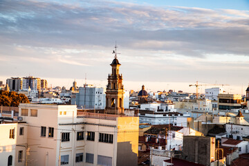 Obraz premium VALENCIA , SPAIN - DECEMBER 6, 2021: aerial cityscape view from Serranos towers on the old town of Valencia city in Spain
