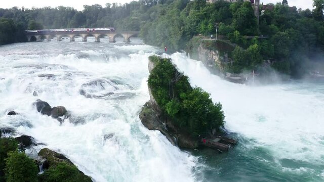 Aerial Panning Beautiful Shot Of Train Moving On Bridge, Drone Flying Over Rhine Falls - Schaffhausen, Switzerland