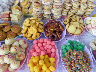 Fototapeta Traditional sweets: cookies, jelly, candy, chocolate, marshmallow, nuts and more  during catholic Corpus Christi celebration in numerous stands at open market in Cuenca, Ecuador obraz