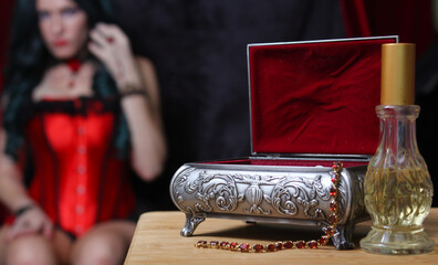 Jewelry Box with Woman in Corset in background, Shallow DOF, Focus on Jewelry Box