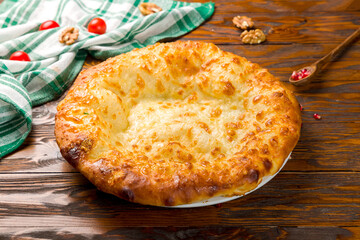 khachapuri with cheese, megrelian khachapuri, georgian cuisine on wooden table