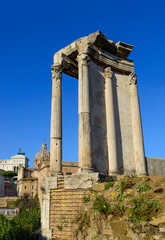 Fototapeta na wymiar Blue sky above the ruined colonnade in the Roman forum in Rome, Italy