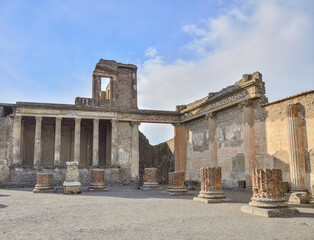 Fototapeta premium Blue sky above the ruined Roman city Forum of Pompei. The Forum represented by main square where main civil activities were carried out, both religious and commercial.