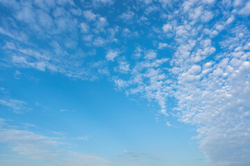 Naklejka na ściany i meble Blue sky and white clouds background on daytime