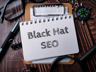 Notebook with Toolls and text Black Hat SEO.