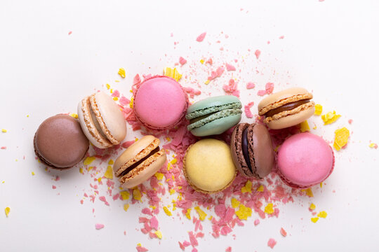 Colorful french macarons on pastel background traditional dessert in France