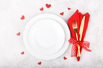 Romantic table setting on white stone table. Valentine's day card template