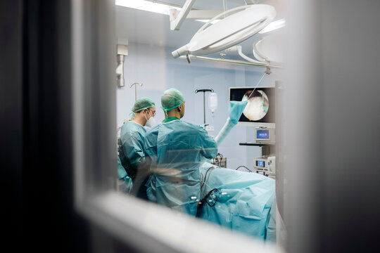 Surgeons doing joint examination in hospital