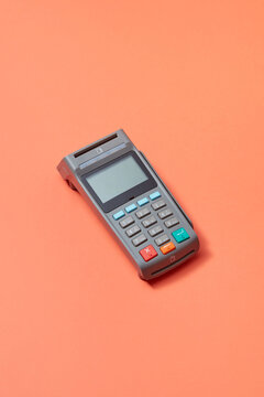 Payment terminal on orange background