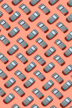 Pattern of payment terminals on orange background