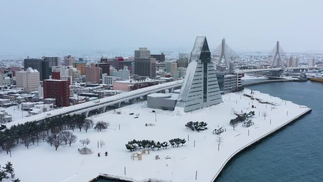 Aomori City Japan, Aerial Rise Shot as Snow Covers the Landscape
