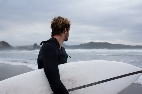 Surfer observing waves