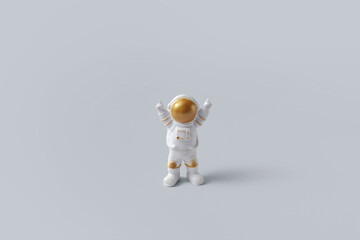 Happy astronaut standing with raised hands