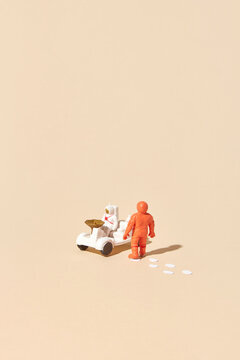 Cosmonauts riding space rover