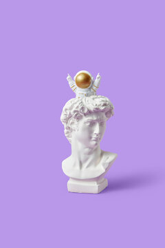 Spaceman sitting on statue of David's head