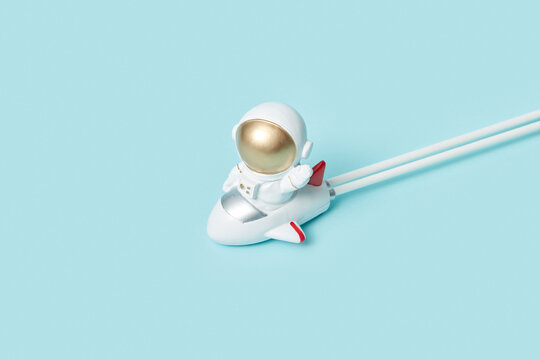 Happy astronaut flying in rocket